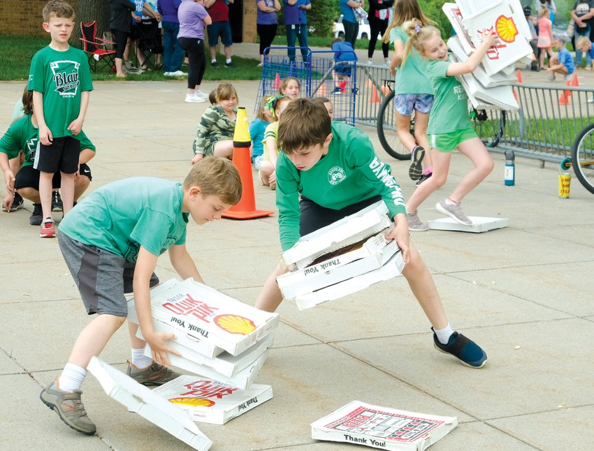Arbor Park students collect as many pizza boxes as possible for the pizza box relay.