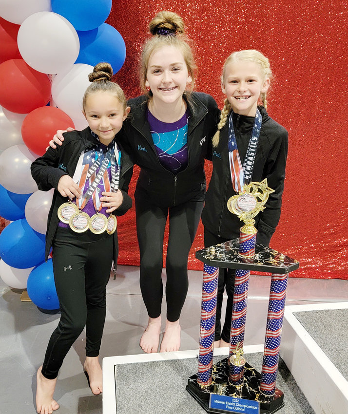 Macadie Soll, Neelei Walpole, and Hadley Peterson show off their hardware.