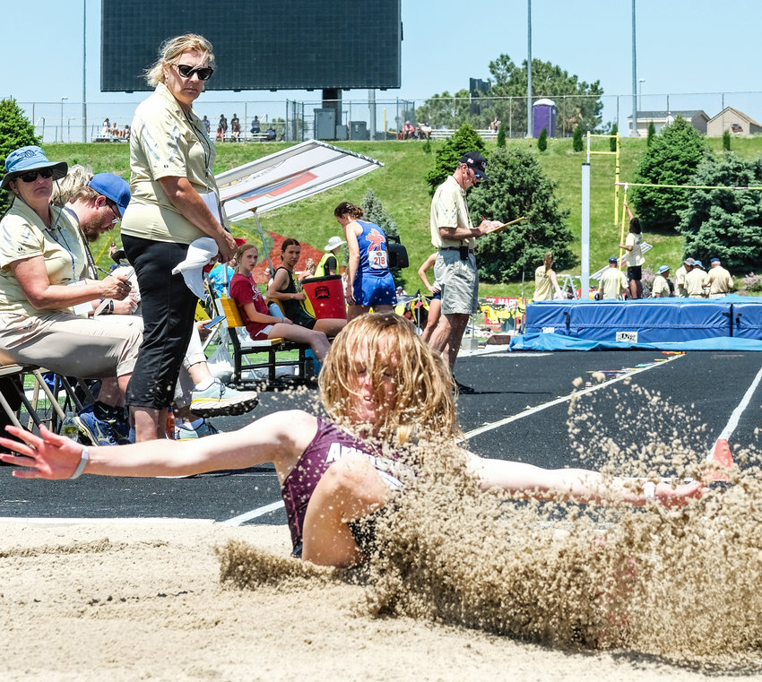Arlington junior Keelianne Green hits the sand Wednesday at Omaha Burke Stadium.