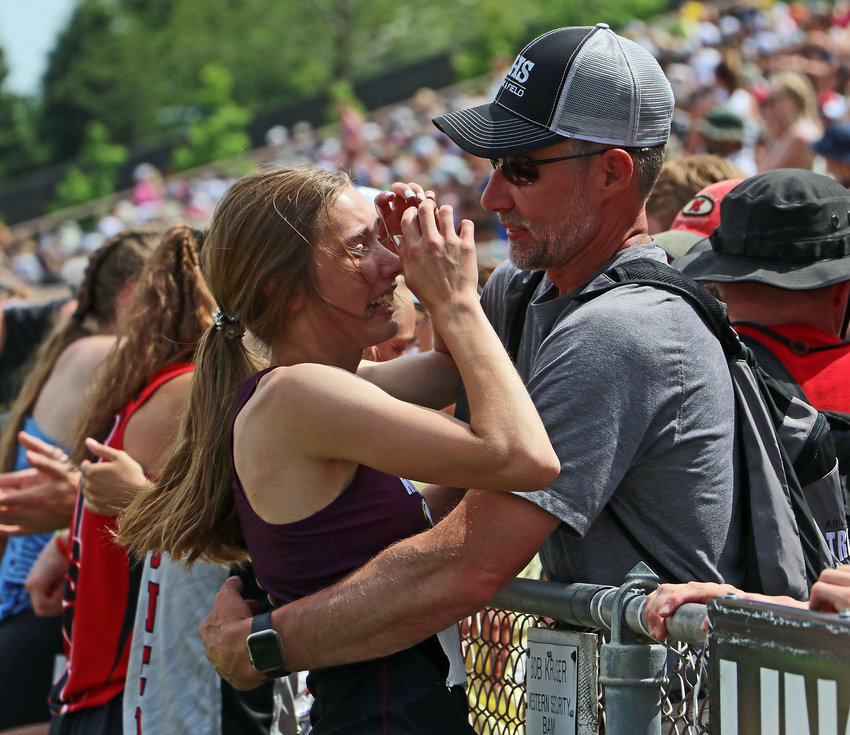 Arlington's Kailynn Gubbels, left, celebrates her 100-meter hurdles state record with her father, coach Steven Gubbels, on Thursday at Omaha Burke Stadium.