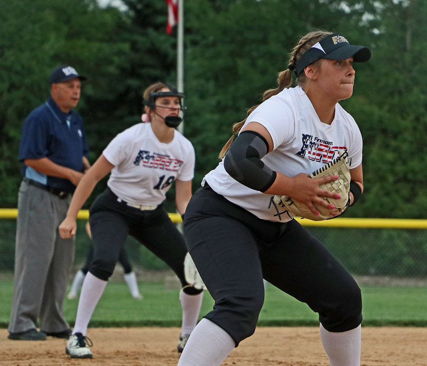 Arlington softball player Cadie Robinson, right, plays third base for the Fremont Force on June 3 at the Blair Youth Sports Complex.