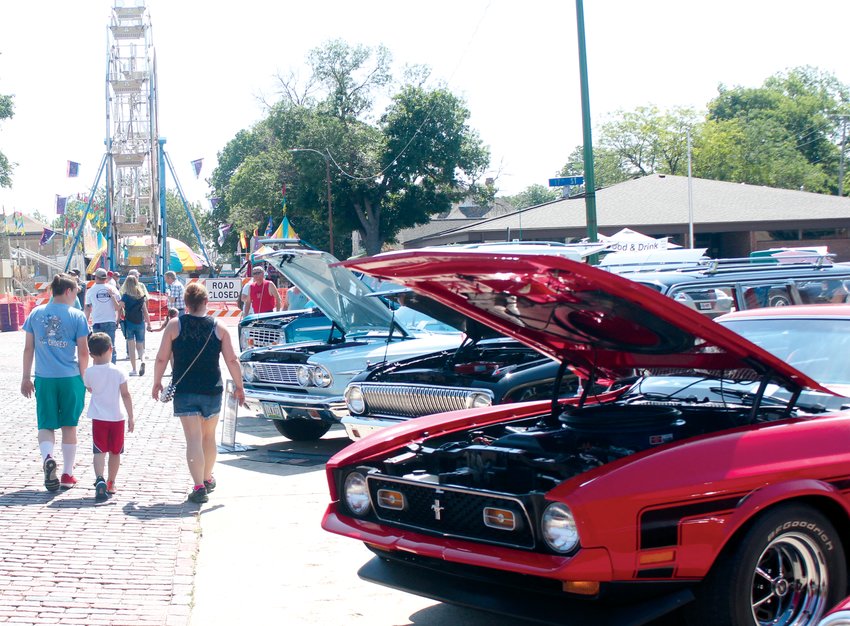 The carnival provided a festive backdrop for the Gateway to the West Days car show.