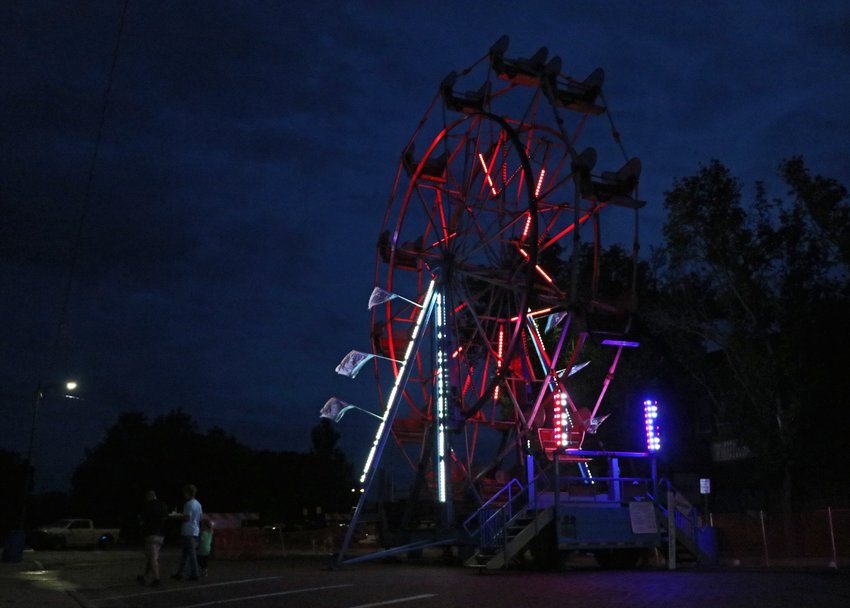 A ferris wheel lights the dark sky Thursday during the first day of the Gateway to the West Days carnival in Blair.