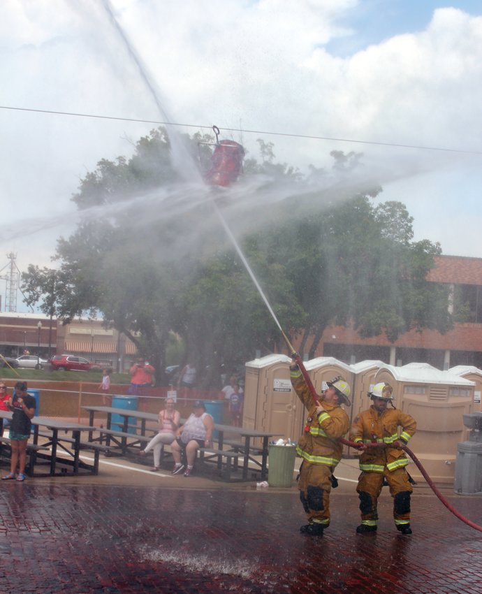 Firefighter teams from Kennard, Nickerson, Blair competed in the water fights following the Gateway to the West Days parade Saturday afternoon.