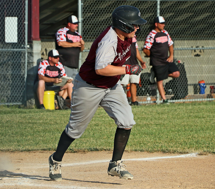 Arlington age 14 and younger batter Luke Ott takes off for first base against Fort Calhoun on Tuesday at the Two Rivers Sports Complex.