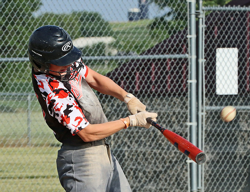 Fort Calhoun batter Adam Elofson lifts the ball into the outfield with his swing Tuesday at the Two Rivers Sports Complex.