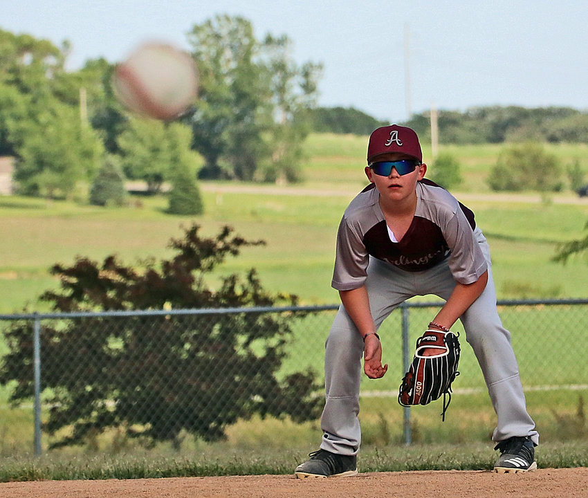 Arlington 12U shortstop Mason Hasenauer watches a pitch in his stance June 2 at the Two Rivers Sports Complex.