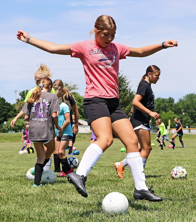 Anna Stirek, 12, works on her foot skills Tuesday at the Blair Youth Sports Complex.