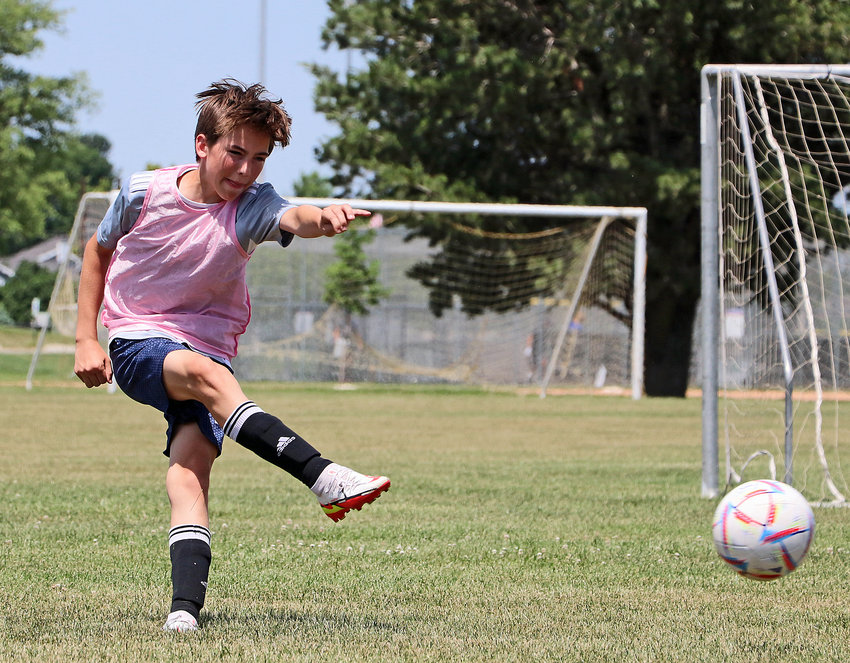 Tommy Scott, 13, fires a shot on goal Tuesday at the Blair Youth Sports Complex.