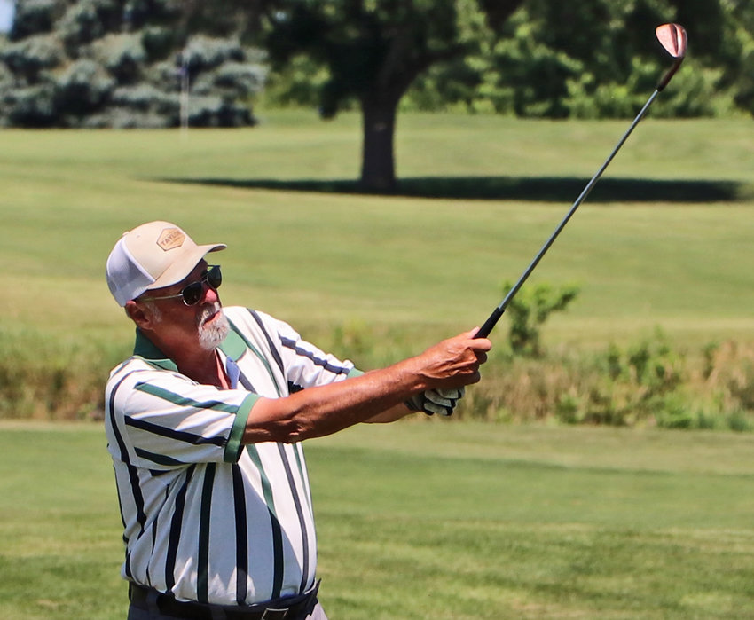 Jeff Christiansen finds the green with this No. 9 approach shot Wednesday at River Wilds Golf Club.