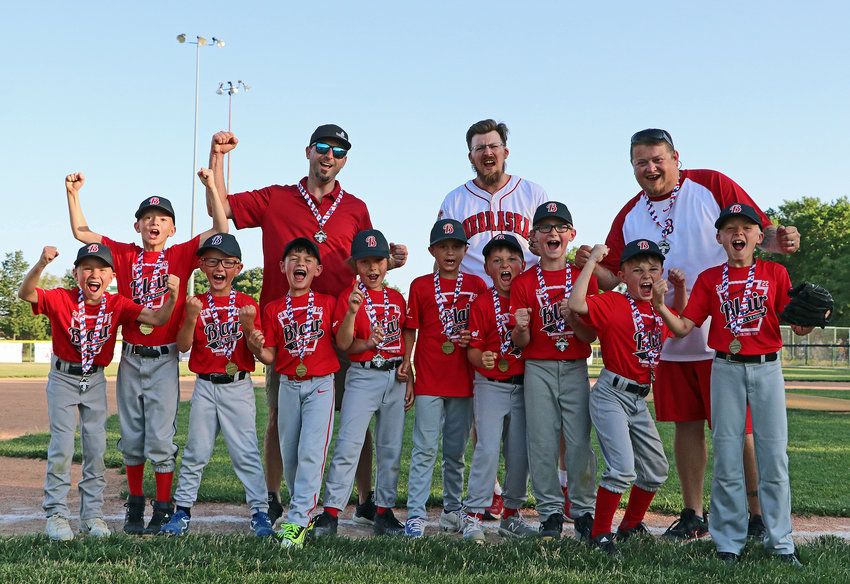 The Rookie division champion Red Sox pose for a photo Tuesday at the Blair Youth Sports Complex. They are Kyler Reardon, front row from left, Zachary Schafersman, Jonas Brown, Noah Terwilliger, Brenden Hopple, Hank Beckenhauer, Pitcher Clemons, Bryson Haynie, Clark Sturm and Reiland Mullally. Back row: Coaches Blaine Clemons, Kenny Schafersman and Kevin Reardon.