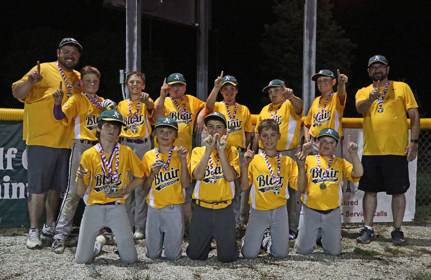 The Major League champion A's pose for a photo Tuesday at Wederquist Field. They are Rowan Morgan, front row from left, Kadn Cartwright, Lucas Palmer, Trace Stratman and Cadyn Beyerink. Back row: Coach Ryan Larsen, Tyce Larsen, Donovan Maggio, Drake Jennings, Richie Kelley, Tregan Baker, Quinnton Foulk and coach Josh Foulk.