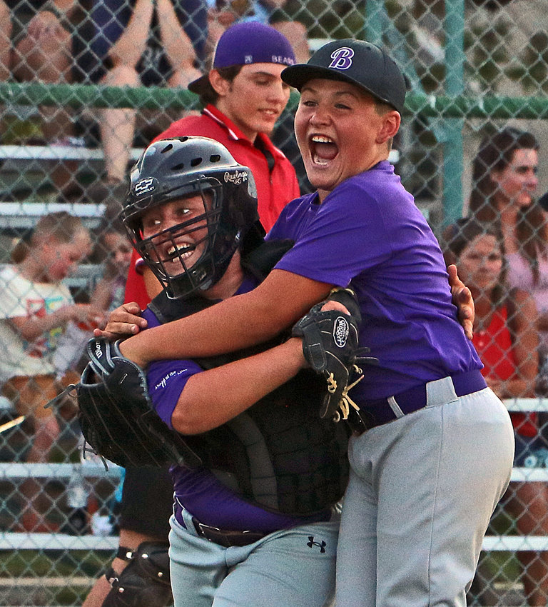 Rockies Calan Herber, left, and Mason Gubbels celebrate Tuesday at the end of the Minors tournament final at Wederquist Field.