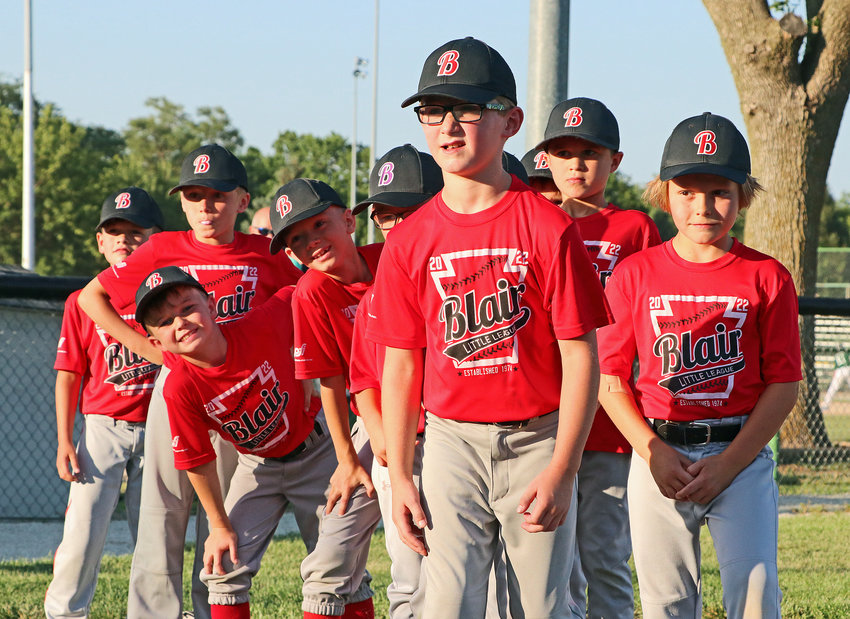 Bryson Haynie, front, and the Blair Little League Red Sox line up for their first-place Rookie division medals Tuesday at the Youth Sports Complex.
