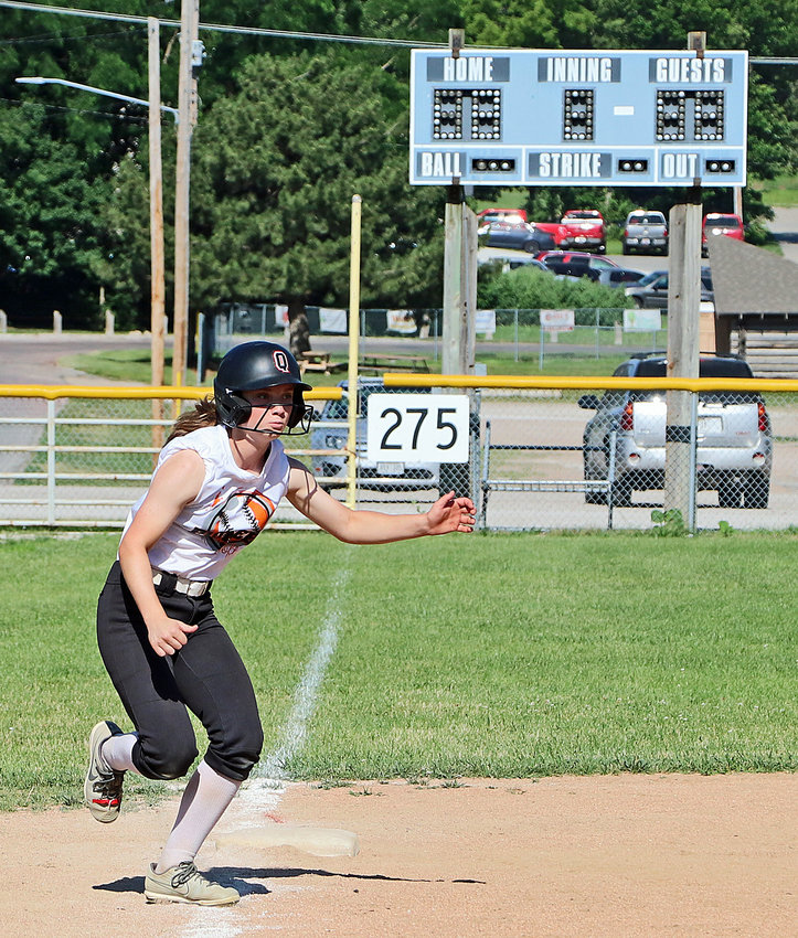 Pioneers base runner Kaylee Taylor leads off of third base June 29 during a camp session in Fort Calhoun.