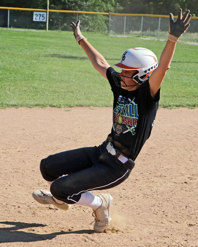Izzy Greenough slides into second base June 29 in Fort Calhoun.