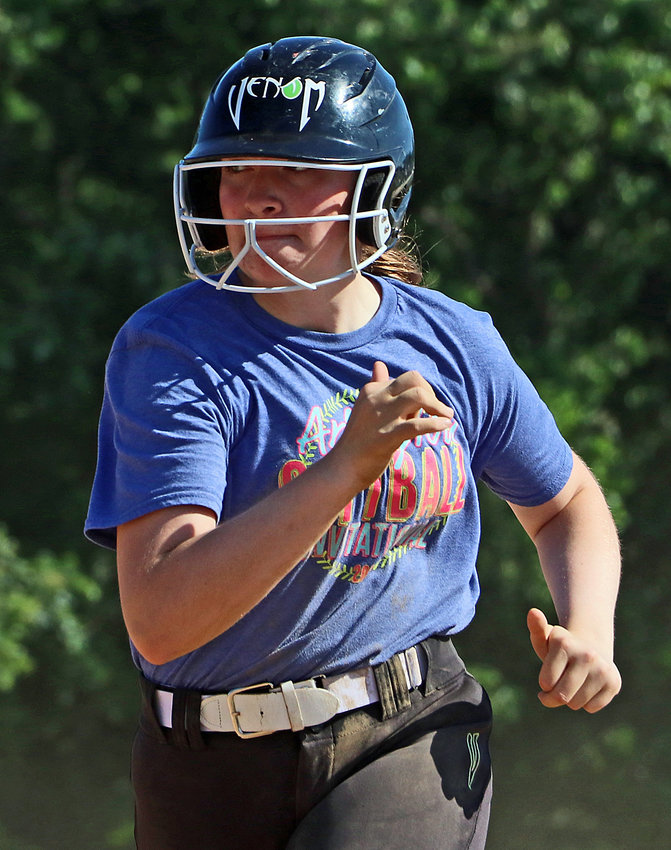 Lucie Larsen runs the bases June 29 in Fort Calhoun.
