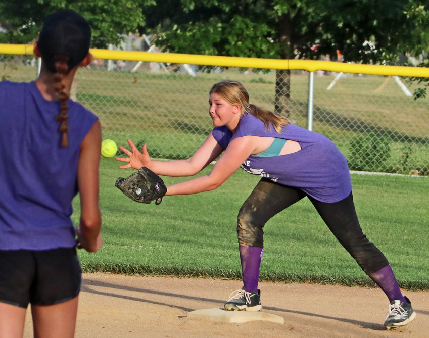Reata Malmberg of the A Division All-Stars catches a throw to second base June 30 at the Youth Sports Complex.