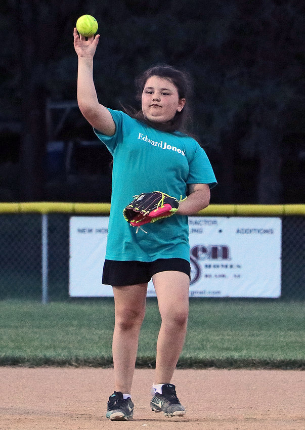 Edward Jones infielder Bella Foged throws the ball to her pitcher June 30 at the Youth Sports Complex.