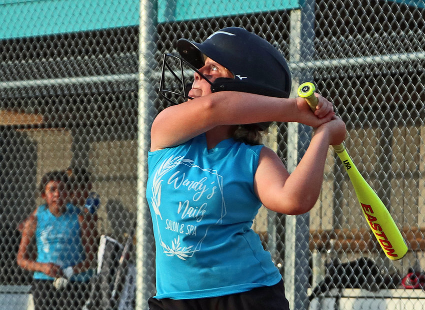 Grace Ell of Wendy's Nails eyes a high pitch June 30 at the Youth Sports Complex.