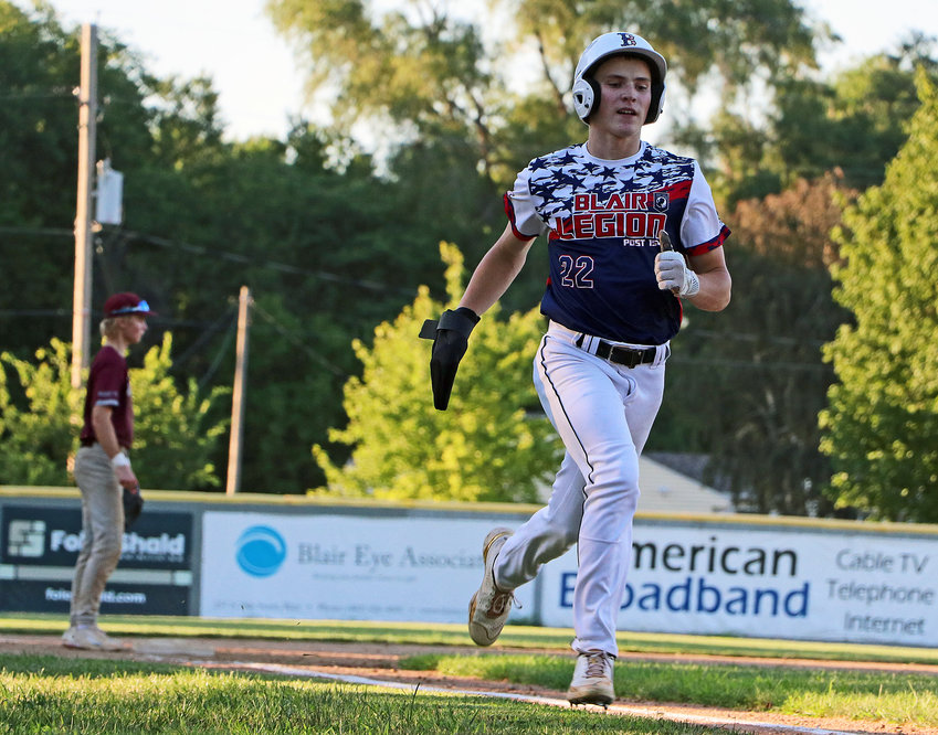 Blair Senior Legion base runner Tanner Jacobson races to home plate Monday at Vets Field.