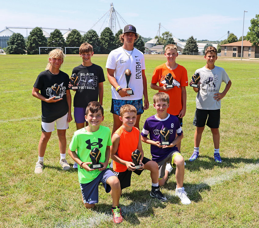 Top Gun and the bracket champion honorees pose for a photo Tuesday during Quarterback Camp at Blair High School. Front row, from left: Will Whitwer (fourth grade), Brayden Mostek (third) and Colin Jacobitz (fifth). Back row: Landry Larsen (sixth), Brevin Leggott (seventh), Bode Soukup (high school), Isaak Schultz (sixth) and Lane Christensen (eighth).