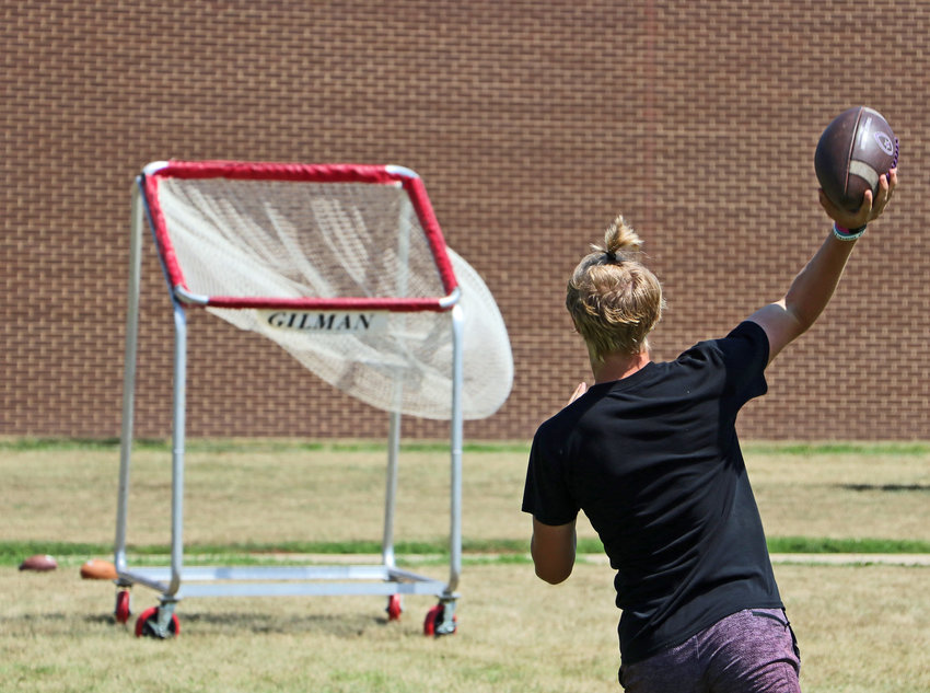 Griffin Rosterman, 14, makes a throw toward a basket Tuesday at Blair High School.