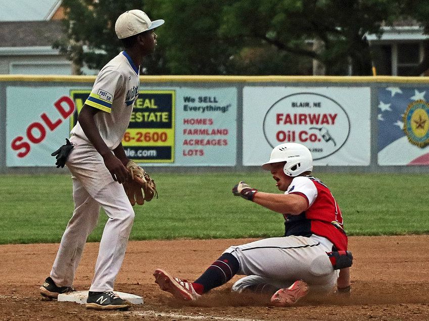 Blair Senior Legion ballplayer Dylan Swanson, right, slides in safe with a triple against Waterloo-Valley on Monday at Vets Field.