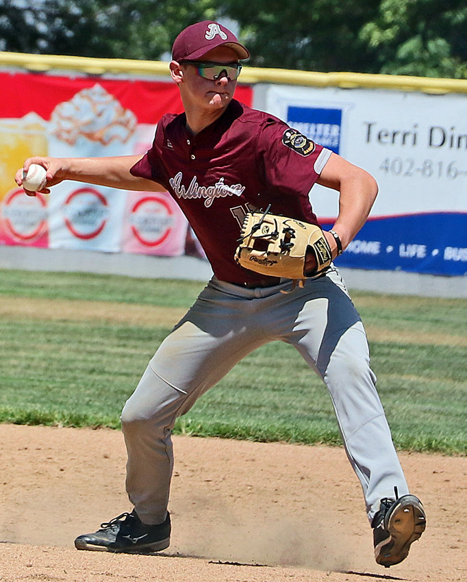 Arlington infielder Dalton Newcomer throws the ball to first base for an out Friday at Vets Field.