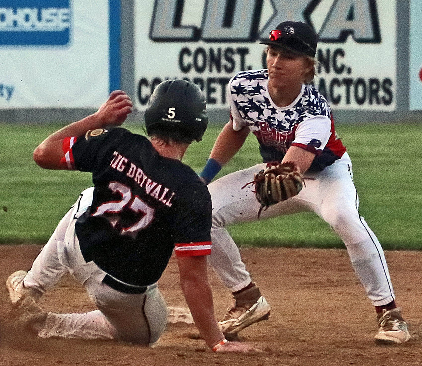 Blair infielder Greyson Kay, right, nabs the ball and tags Fort Calhoun's Carter Christensen out at second base Friday at Vets Field.