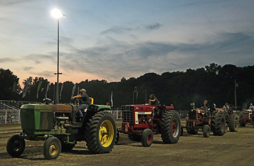 Tractors line up for Tuesday's Golden Harvest Tractor Pull at the Washington County Fairgrounds.