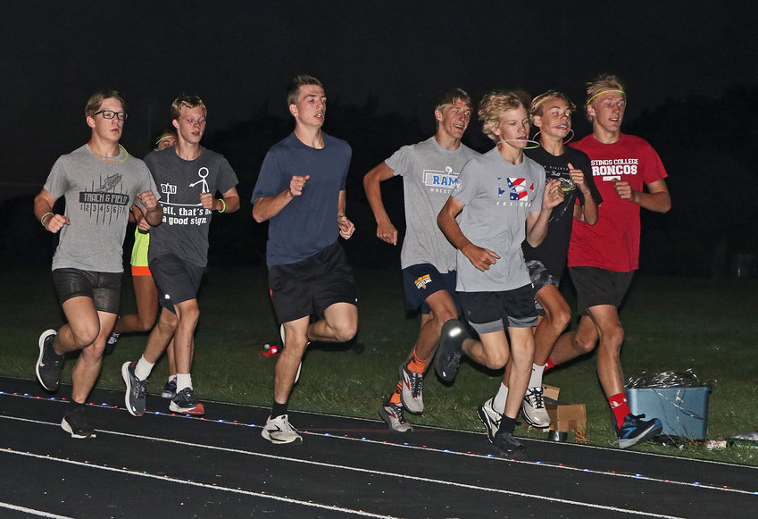 Pioneers run in the dark Monday at Fort Calhoun High School.