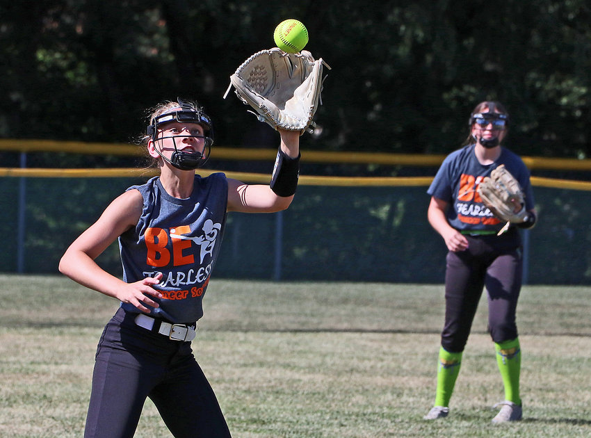 Izzy Greenough gloves the ball Aug. 10 during practice in Fort Calhoun.