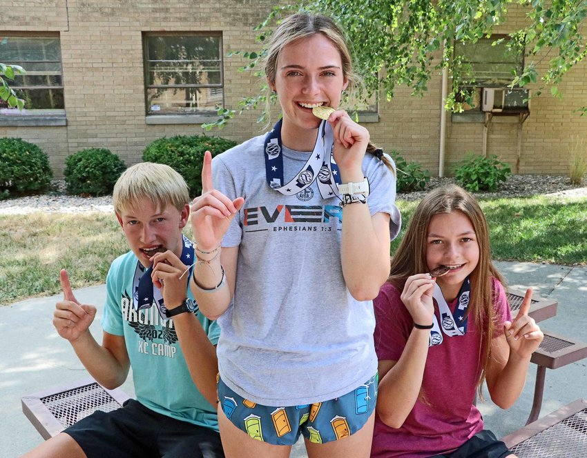 Arlington cross-country runners Nolan May, from left, Keelianne Green and Hailey O'Daniel earned Class C state medals in 2021. Green, a senior, is the defending state champion.