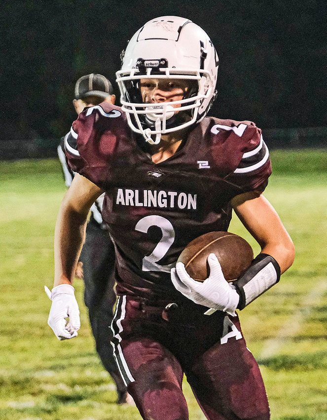 Eagles sophomore Kieryn Grothe carries the football after a catch Friday at Arlington High School.