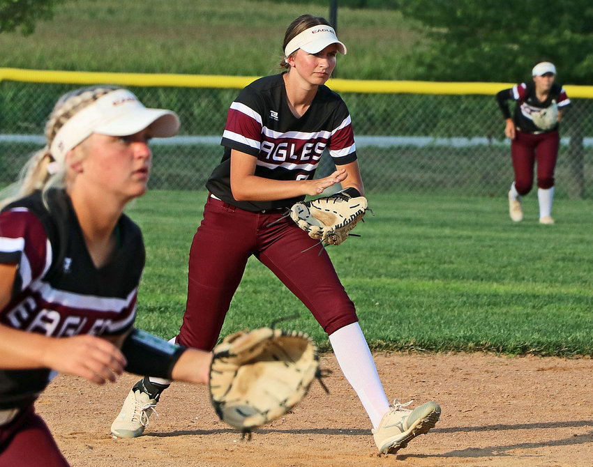 Arlington shortstop Britt Nielsen, middle, plays next to Hannah Stahlecker, left, and in front of outfielder Emery McIntosh on Thursday at Two Rivers Sports Complex.