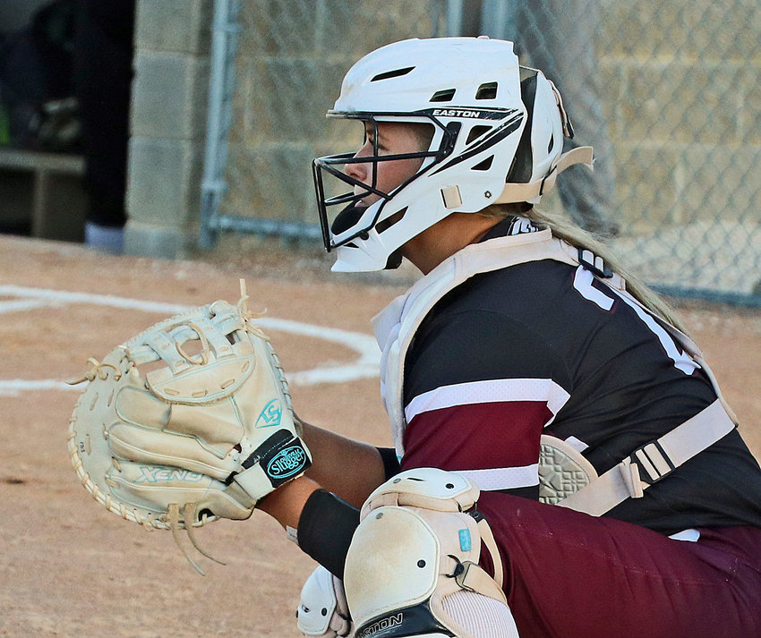Arlington senior Cadie Robinson plays behind the plate Thursday at Two Rivers Sports Complex.