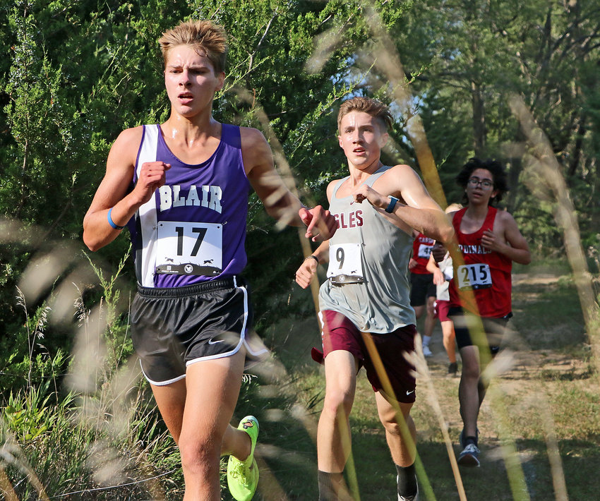 The Bears' Ted Lueders, left, and Arlington's Luke Hammang, second from left, run Thursday at Otte Blair Middle School.