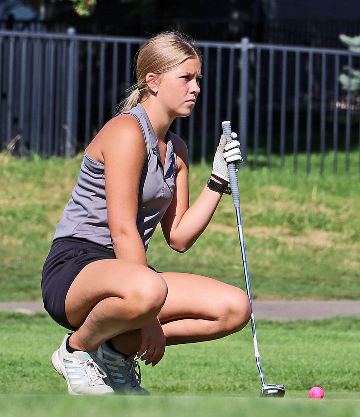 Blair senior Mallory Stirek sets up a putt Tuesday during the Eastern Midlands Conference Tournament at Pacific Springs in Omaha.