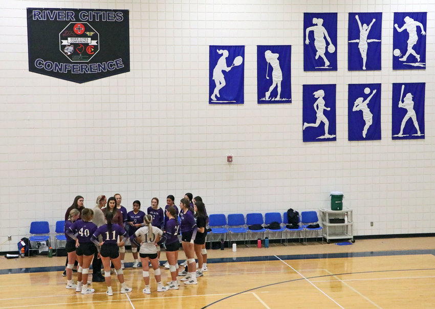 The Blair volleyball team huddles Tuesday during the third set at Omaha Mercy.