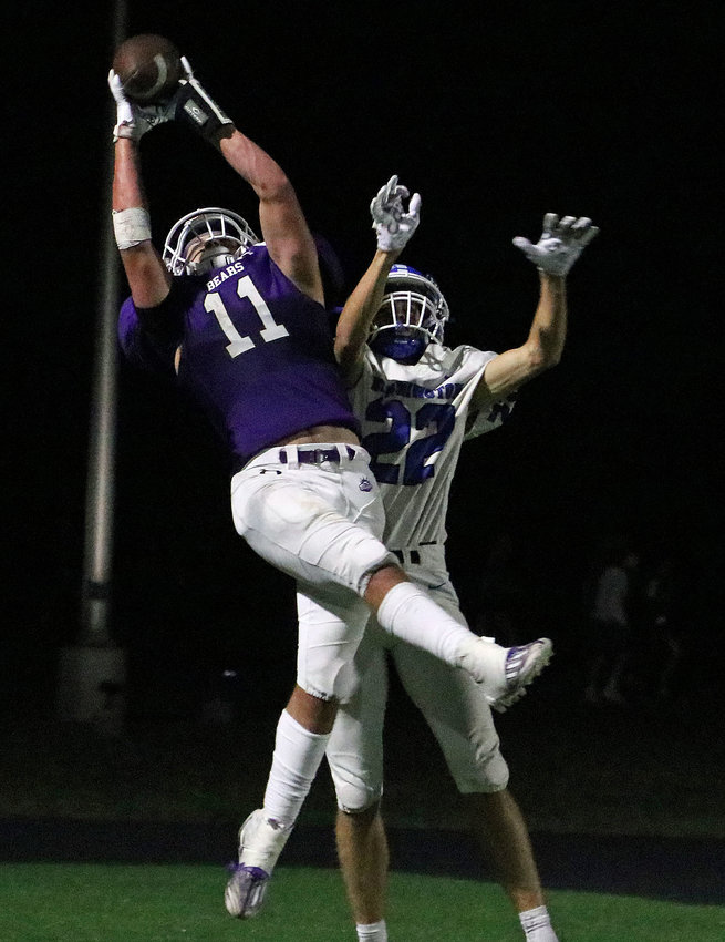 Blair junior Brayd Brown, left, pulls down a fourth-quarter touchdown reception Friday while defended by Bennington's Beau Pick at Krantz Field. The Bears fell to the Badgers, 45-7.