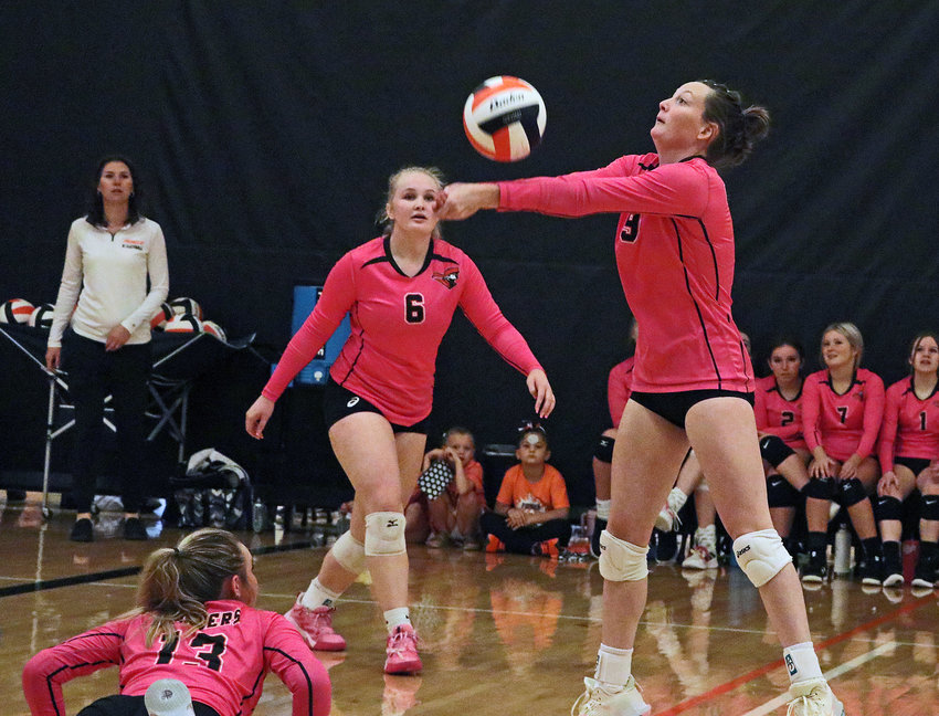 Pioneers senior Grace Genoways, right, makes a play on the ball as Raegen Wells (6) and Tilden Nottlemann (13) watch Saturday at Fort Calhoun High School.