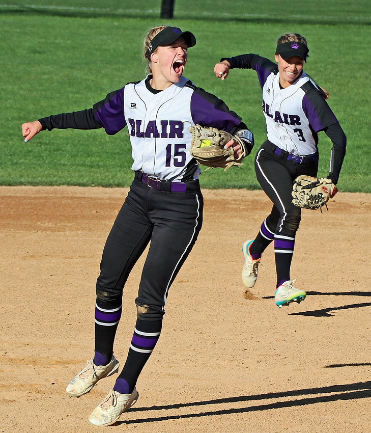 Blair Bears Nessa McMillen, left, and Leah Chance celebrate an out Wednesday in Hastings.