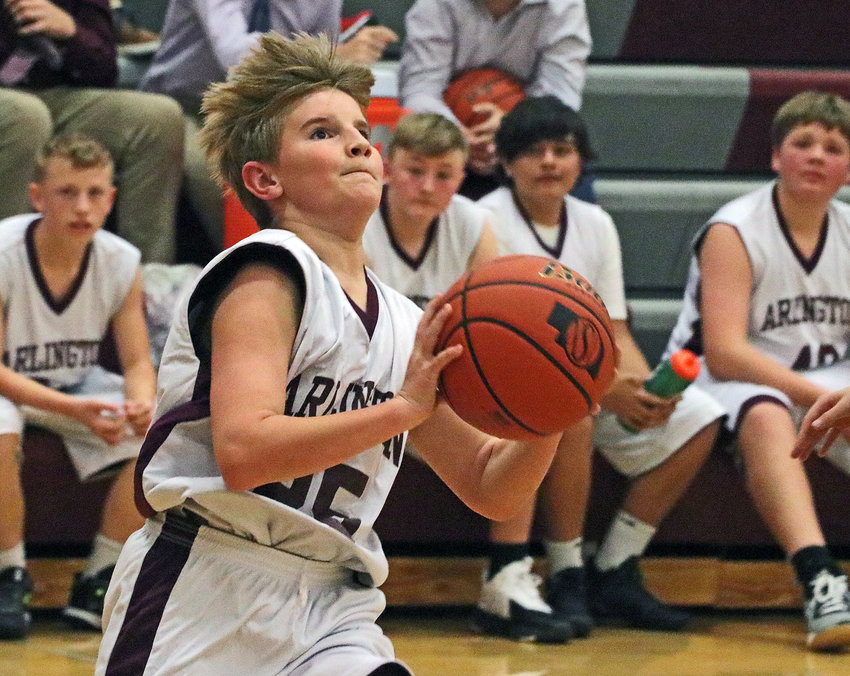 Eagles seventh-grader Andy Jess drives to the basket Tuesday at Arlington High School.