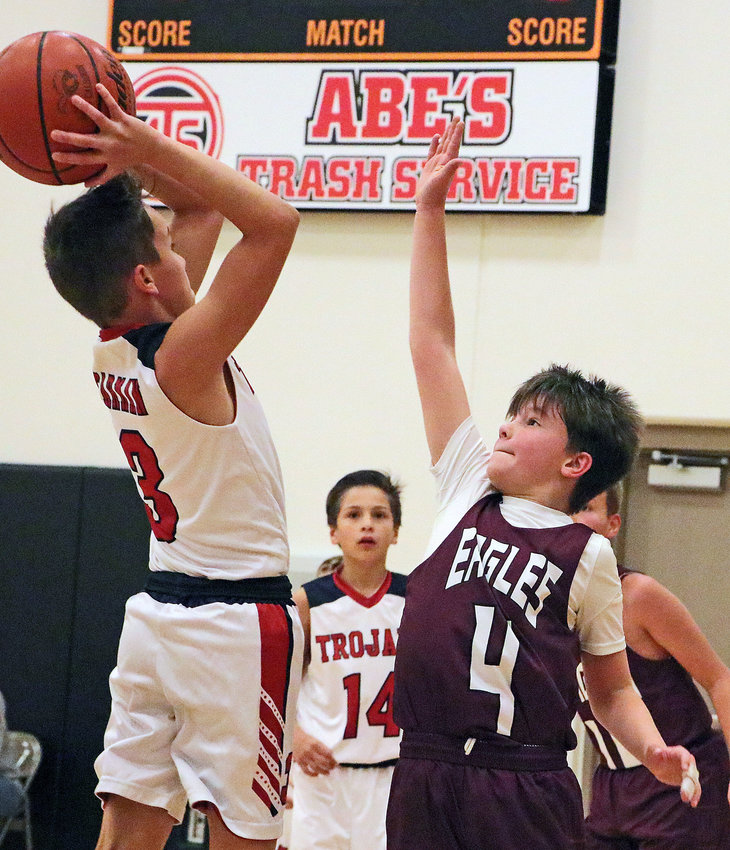 Grant Monke, right, of the Arlington White squad plays defense Saturday at FCHS.