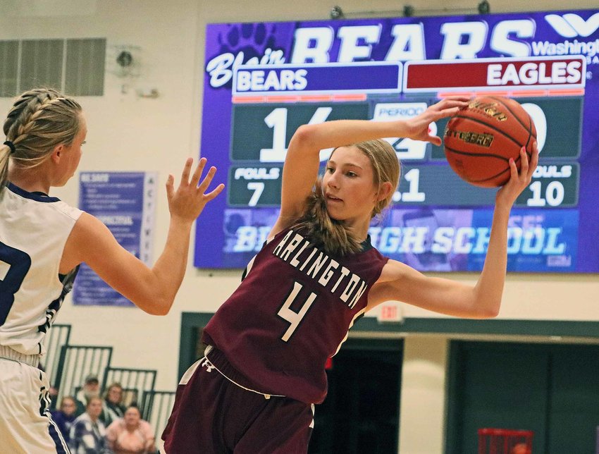 Arlington's Macy Wolf, right, looks to pass around the Bears' Leah Chance on Monday at Blair High School.