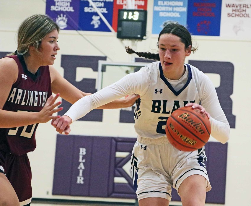 The Bears' Addie Sullivan, right, dribbles while defended by Arlington's Valeria Cavajal on Monday at Blair High School.