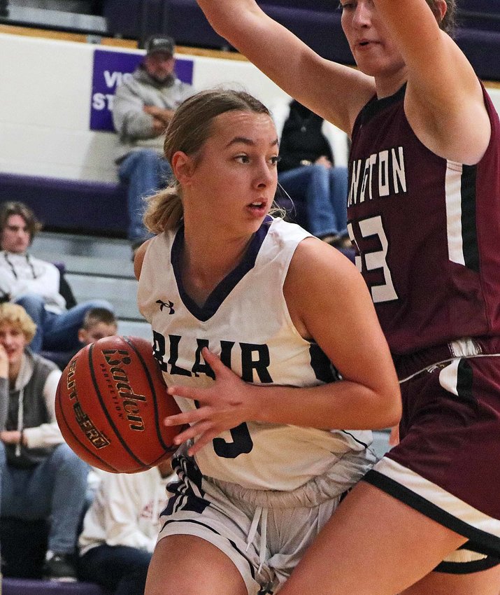 The Bears' Claire Anderson, left, is closely guarded on the baseline by Arlington's Britt Nielsen on Monday at Blair High School.