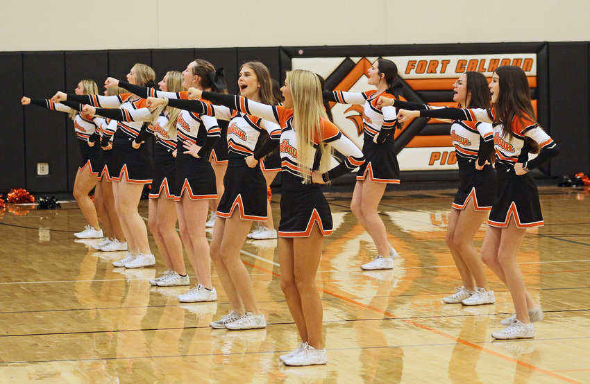 Cheerleaders lead the crowd in support of the Pioneers on Monday at Fort Calhoun High School.