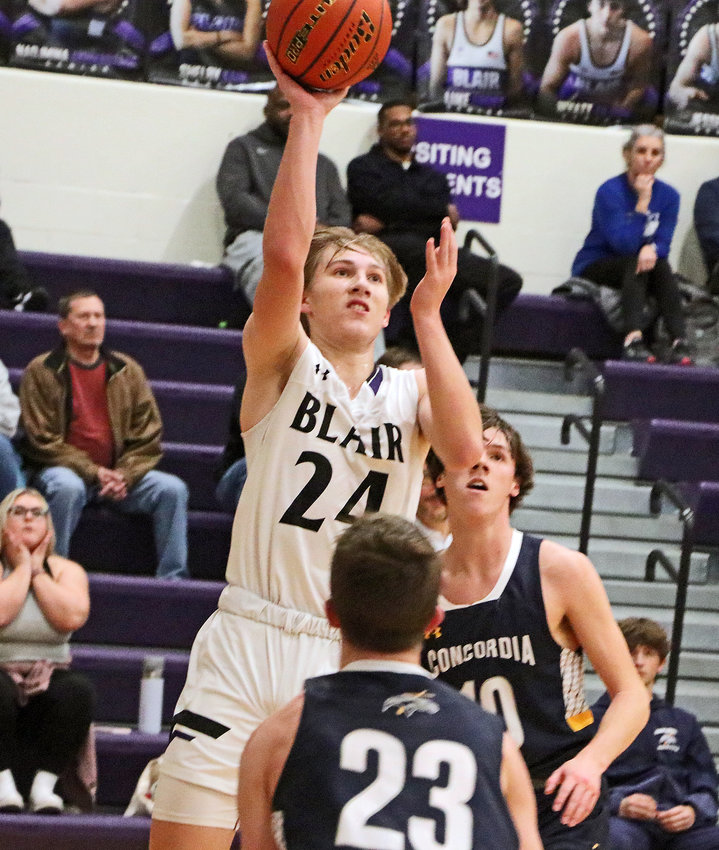 Bears senior Greyson Kay scores a bucket at the end of the first half Tuesday against Omaha Concordia at Blair High School.